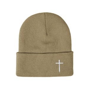 Knitted khaki beanie hat featuring a white embroidered cross on the ribbed cuff brim