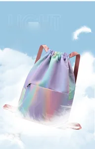 Detail of lightweight gradient drawstring backpack floating with feathers in the sky