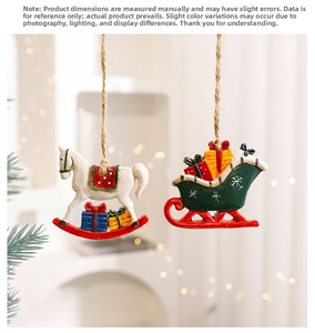 Detail of hand-painted Christmas resin ornaments with wooden rocking horse and green sled