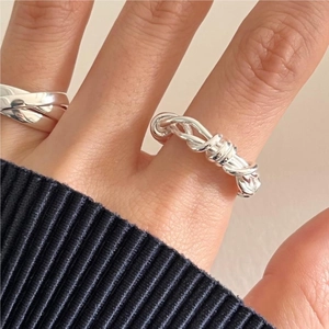 Minimalist S925 sterling silver knotted rope ring on model for a trendy look