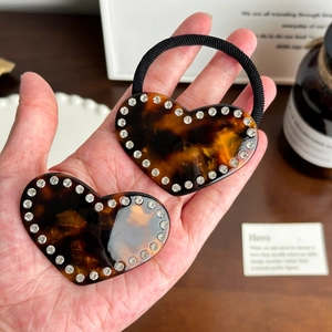 Elegant tortoiseshell resin heart hair tie with sparkling crystals for high ponytails