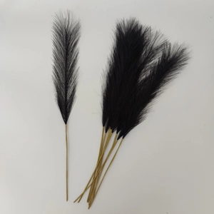 Detail of 55cm black artificial pampas grass with yellow stems for boho home decoration