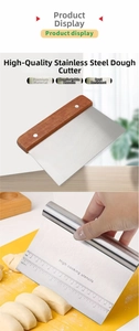 Detail of stainless steel dough scraper featuring measurement scales and a wooden handle