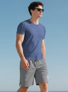 Close-up of men's breathable slim fit athletic t-shirt in heather blue with outdoor sky