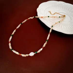 Bohemian beaded necklace with white shell, colored beads, and baroque pearl accent