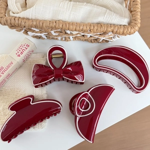 Set of 4 burgundy hair claws with white trim in elegant bow and curved designs