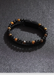 Close-up of men's tiger eye stone beads and braided leather bracelet with magnetic clasp