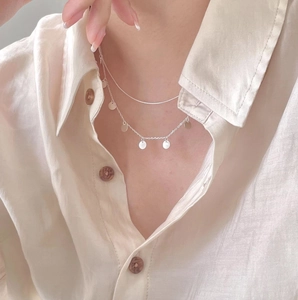 Double-layered 925 sterling silver necklace with sleek snake chain and sequin pendants