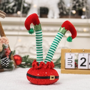 Cute Christmas striped elf legs decoration with red boots on a festive holiday desktop