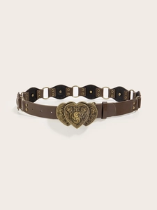 Detailed view of brown leather belt with vintage bronze double-heart engraved buckle
