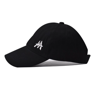 Classic black cotton baseball cap with white geometric embroidery on a white background
