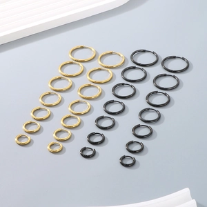 Collection of gold and black stainless steel hoop earrings in various sizes for daily wear