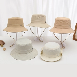 Selection of kids polyester sun hats in earthy tones featuring a smiley face icon
