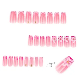 Pink zebra pattern press-on nails with 3D floral accents and elegant french design