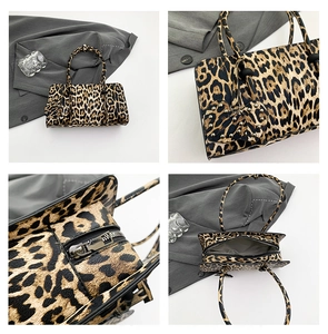 Detailed views of leopard print handbag featuring heart charm and metallic zipper