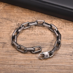 Detail of vintage silver stainless steel bracelet with large rectangular links and lobster clasp