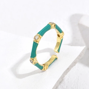 Bamboo style gold plated open ring with green enamel and sparkling zircon accents