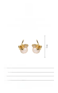 Detail showing dimensions and material specs of freshwater pearl and flower earrings