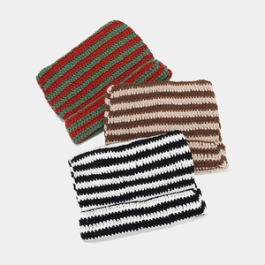 Detailed crochet texture and striped patterns of handmade knit cat ear beanies