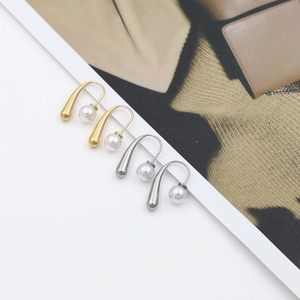 French minimalist 18k gold drop earrings with pearl detail and titanium steel finish