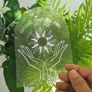 Macro view of holographic suncatcher window film with sunshine state of mind text