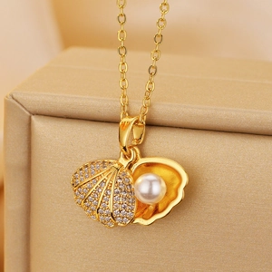 French vintage shell pearl necklace with gold scalloped pendant and micro-set cubic zirconia