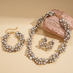 Baroque retro jewelry set with pearls and rhinestones on elegant gold-toned vintage chain