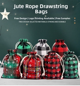 Close-up of Christmas plaid cotton gift bags with snowflakes and drawstring cords