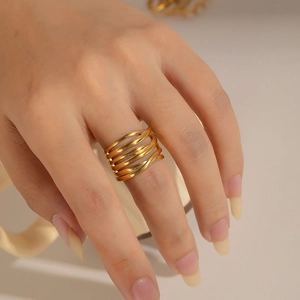 Polished 18k gold plated stainless steel multi-layer wrap ring on model's finger