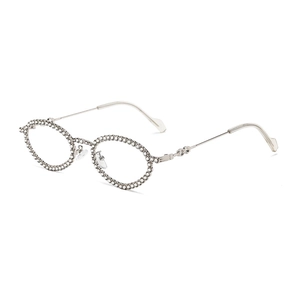 Oval silver metal sunglasses with sparkly rhinestone frame shown from 45-degree angle