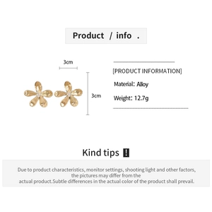 Detail showing gold flower earrings with brushed metal texture and 3cm size measurements