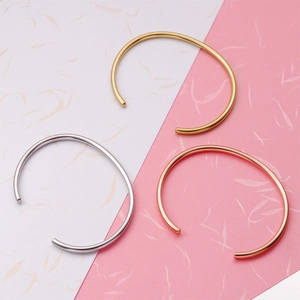Minimalist C-shaped open bangles in gold, silver, and rose gold stainless steel finishes