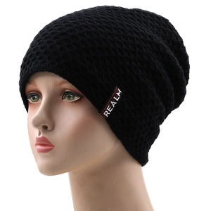 Men's winter black knit beanie with honeycomb texture and white REALM patch detail