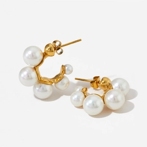 Elegant gold stainless steel C-shaped hoop earrings with pearls on white background