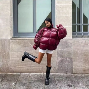 Women's trendy burgundy glossy puffer jacket with high neck collar in a short fit