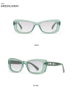 Detail view of green square sunglasses with crystal-embellished temples and gray lenses