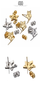 Macro shot of 18k gold and silver star earrings with a textured hammered metal finish