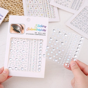 Detail showing 3D adhesive heart and pearl face gems with holographic effect for DIY