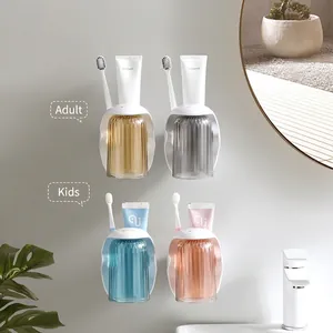 Wall-mounted magnetic toothbrush holder set with four colorful cups for family bathroom use