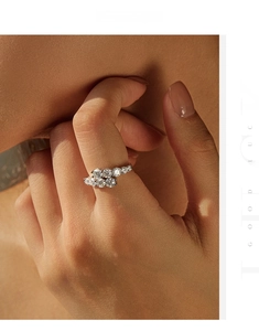 Detailed macro shot of S925 sterling silver cluster ring with sparkling moissanite stones