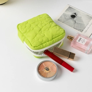 Quilted grass green sanitary napkin storage bag with zipper for cosmetic organization