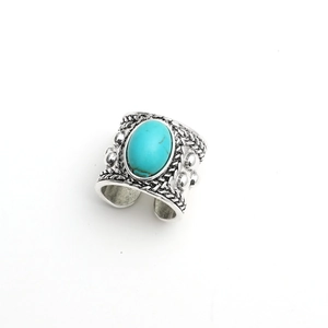 Vintage silver-tone open ring featuring oval turquoise and bohemian braided texture details