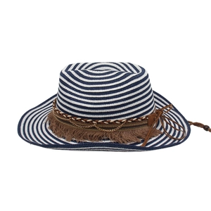 Detail of blue and white striped straw hat with tassels, ropes, and gold chains