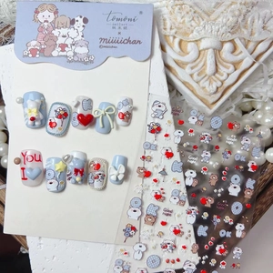 Detailed view of 3D embossed cartoon bear nail art stickers with bow and heart accents