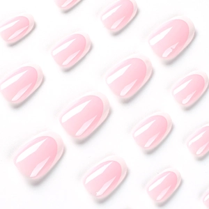 Short square press-on nails with classic French tip design in soft pink and white