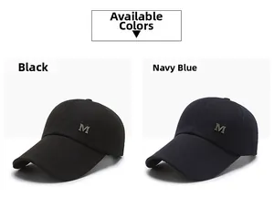 Detail view of cotton baseball caps in black and navy blue with metal M logo accent