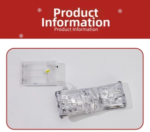 Detail of silver LED Christmas ribbon with cutout stars and snowflake patterns and battery box