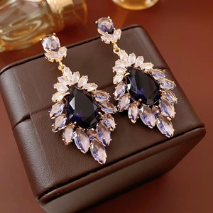 Vintage-style flower drop earrings with purple zirconia and gold plating on leather