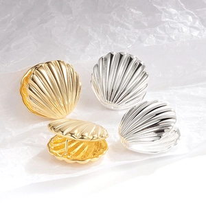 Minimalist French shell-textured hoop earrings in gold and silver metal finishes
