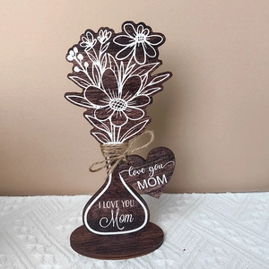 Macro view of Mother's Day wooden flower bouquet ornament with Love You Mom engraving